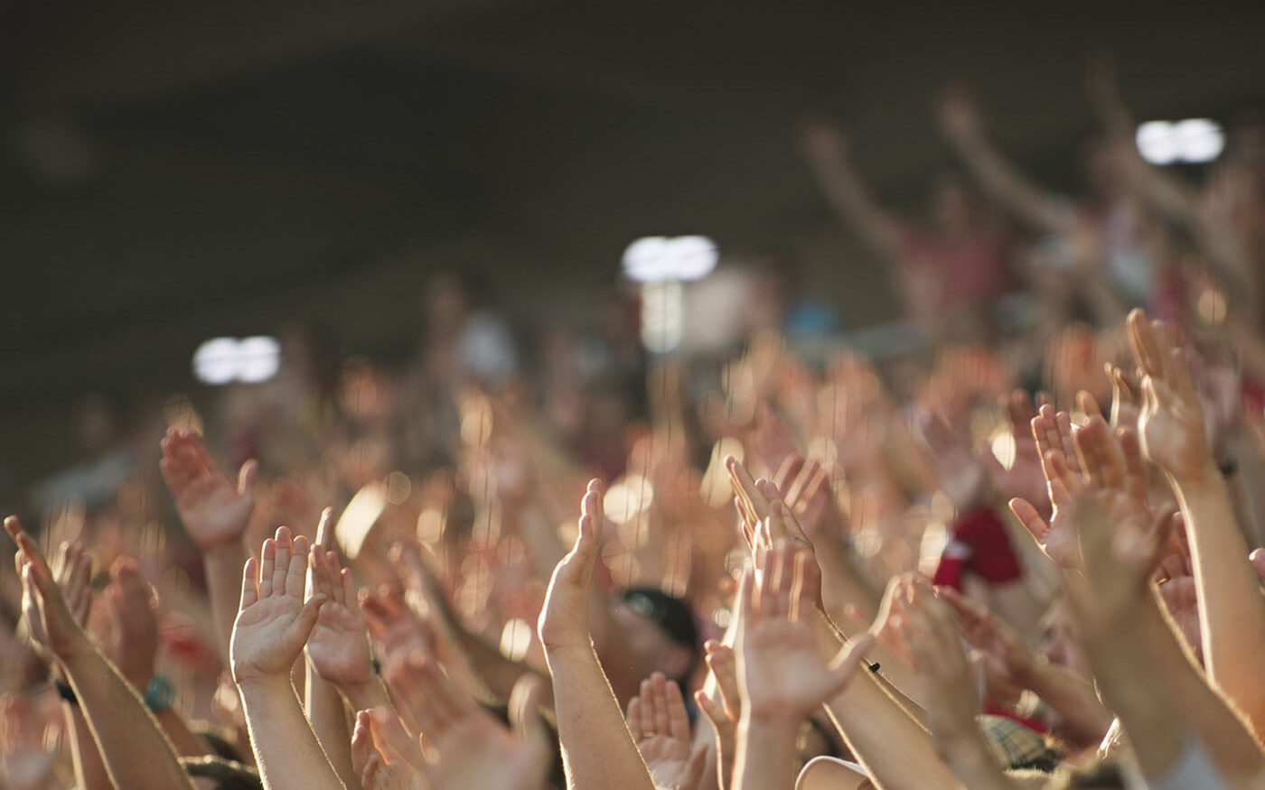 crowd of hands up in the air