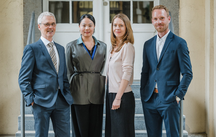 From left, Prof. Dr. Frank Jacob, Linghui Wang, Laura Sommer, Prof. Dr. Erik Hermann