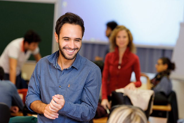 A smiling student in a classroom