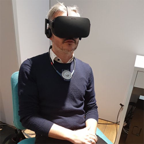 A man is wearing a virtual reality headset in Renault technocentre