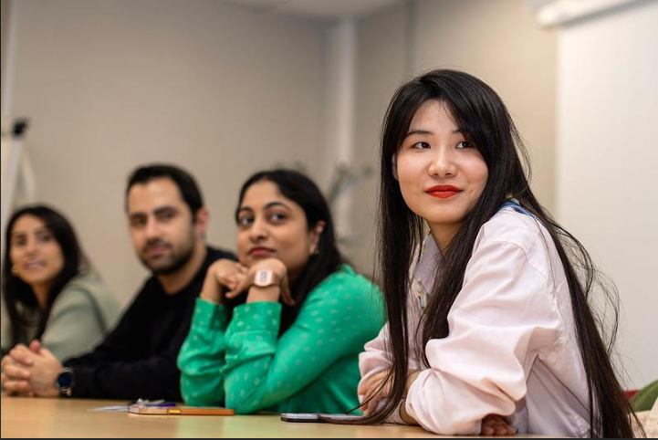 Three ESCP students coming out of a campus