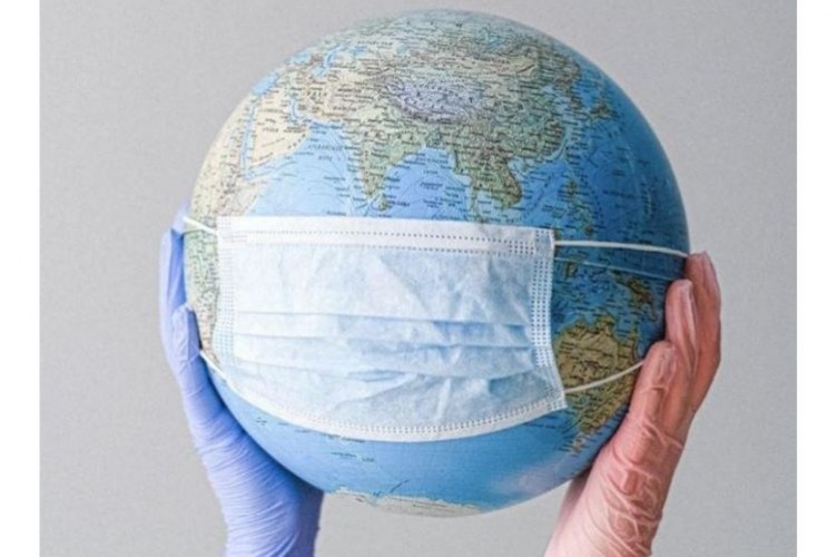 Image of hands holding globe