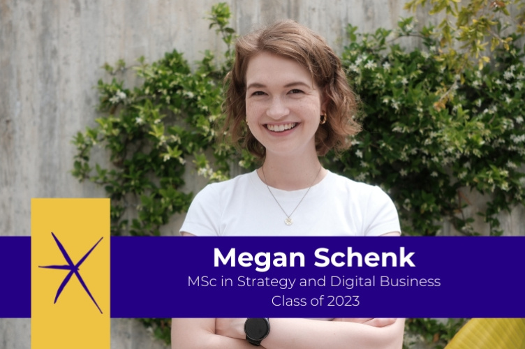 Alumna of the Master in Strategy and Digital Business, Megan Schenk, standing in front of greenery
