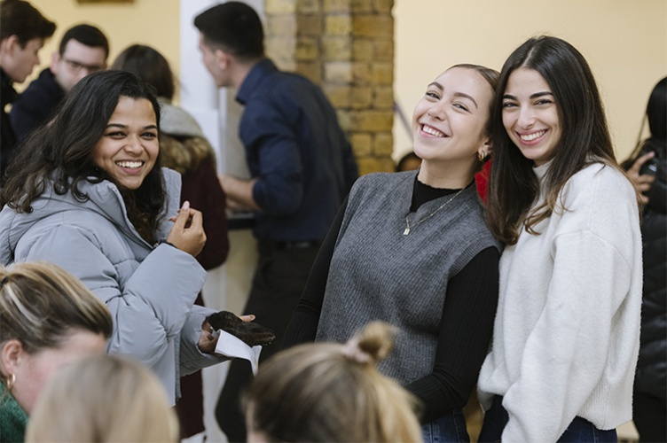 3 smiling female students
