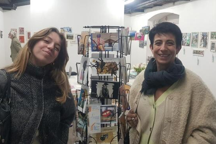 Two persons with postcards