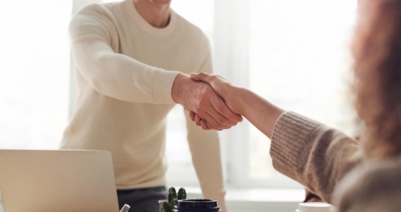 Interview applicant shaking hands with employer