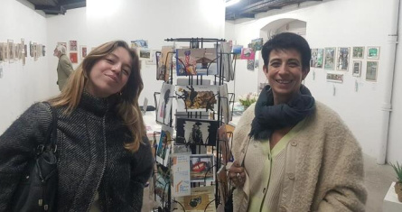 Two persons with postcards