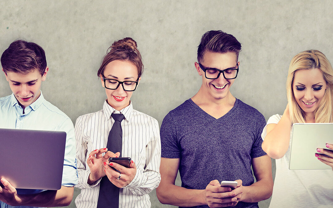 AdobeStock – pathdoc Group of multicultural people connected by using digital devices.