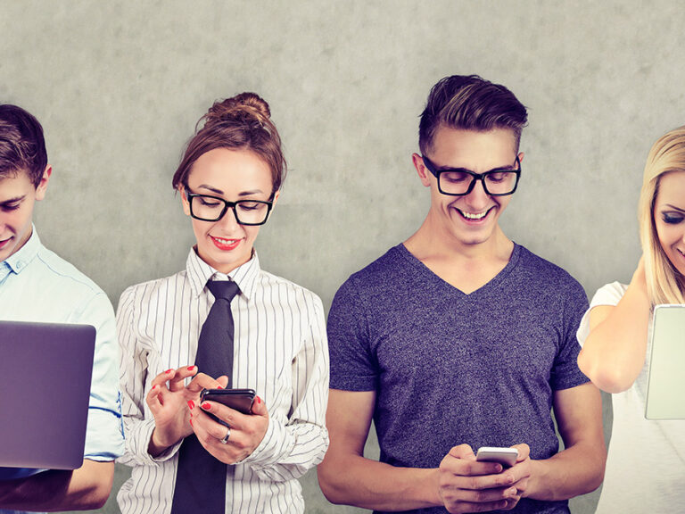 Group of multicultural people connected by using digital devices.
