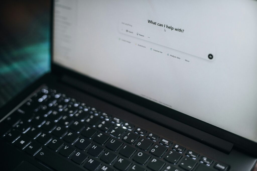Photo of a laptop computer with ChatGPT on the screen