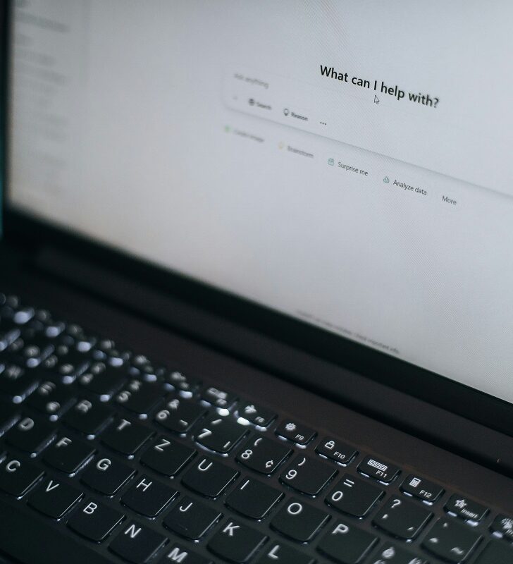 Photo of a laptop computer with ChatGPT on the screen