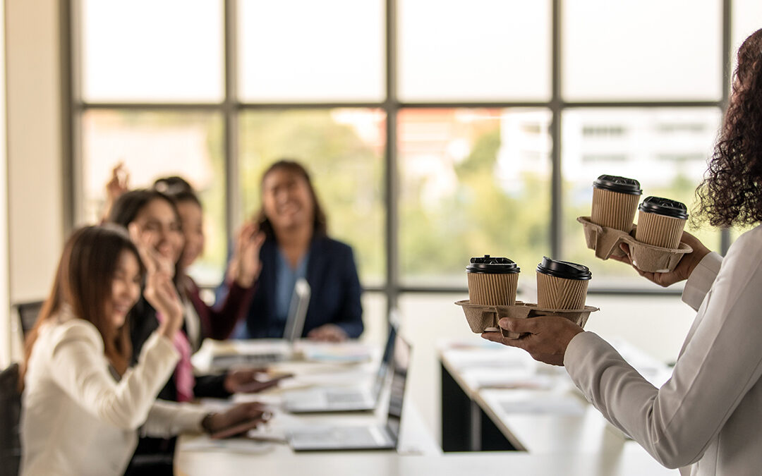 Bangkok Click Studio – AdobeStock Woman brings take-away paper cups of coffee to colleagues greeting and happy with kindness.
