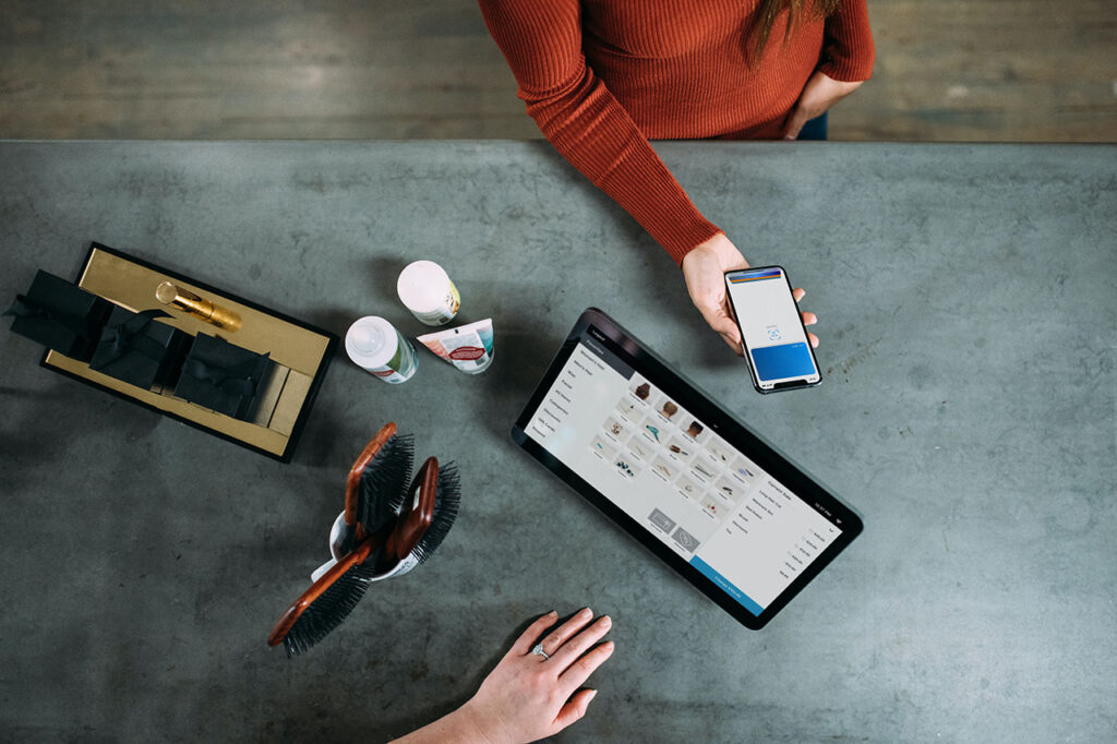 person holding smartphone beside tablet computer, © Blake Wisz / Unsplash