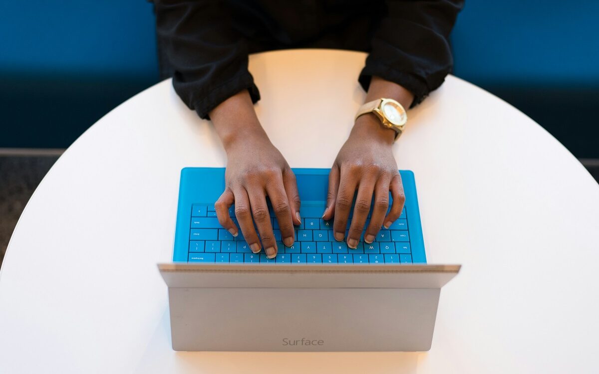 © Christina@wocintechchat.com / Unsplash Picture of women's hands from above typing on a computer keyboard.