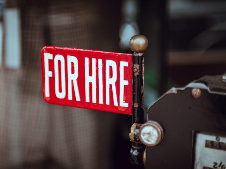 Shallow focus photography of red and white for hire signage © Clem Onojeghuo / Unsplash