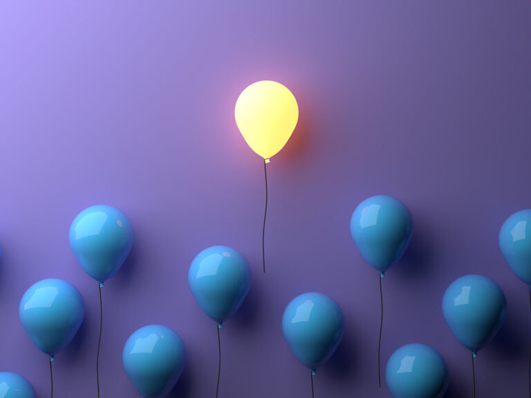 Stand out concept with glowing balloons, ©Colin Fearing / Adobe Stock