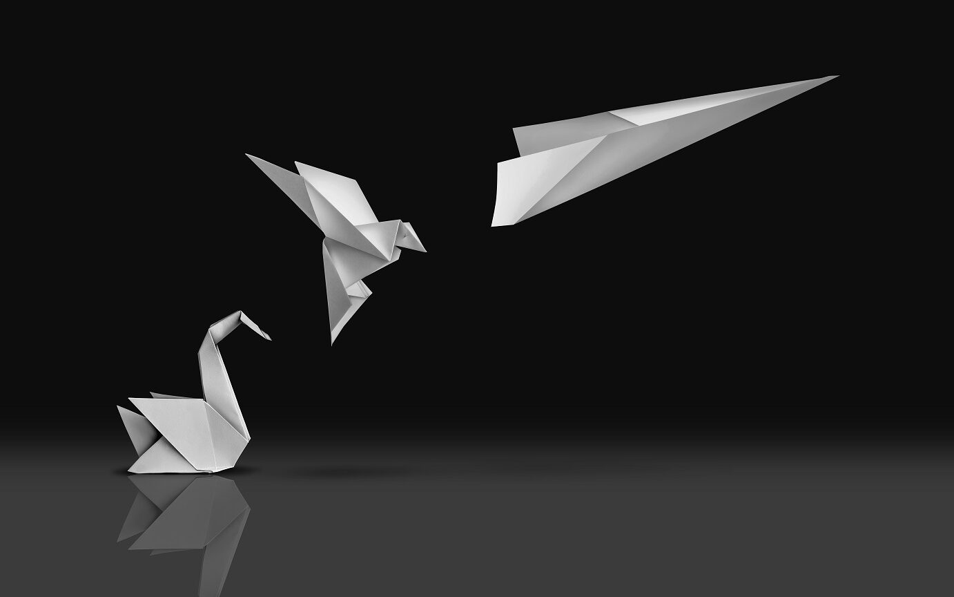 ©Lightspring / Shutterstock Picture of an origami swan transforming into a paper airplane evoking the concept of innovation and transformation