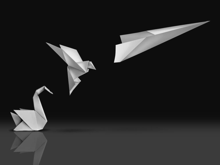 ©Lightspring / Shutterstock Picture of an origami swan transforming into a paper airplane evoking the concept of innovation and transformation
