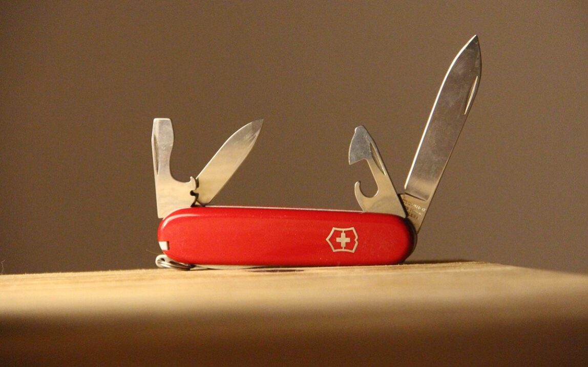 ©Denise Jans/Unsplash A photo of an open swiss army knife representing the idea of cross-functional talent in marketing
