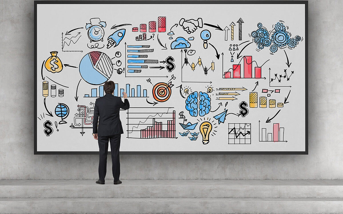 denisismagilov – AdobeStock Business founder on stairs drawing a sketch.