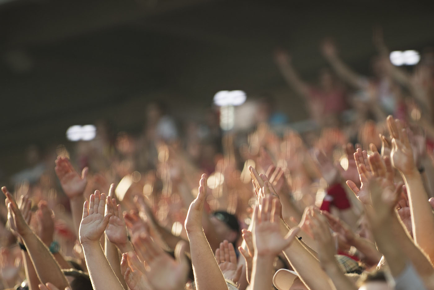 Football fans clapping on the podium of the stadium