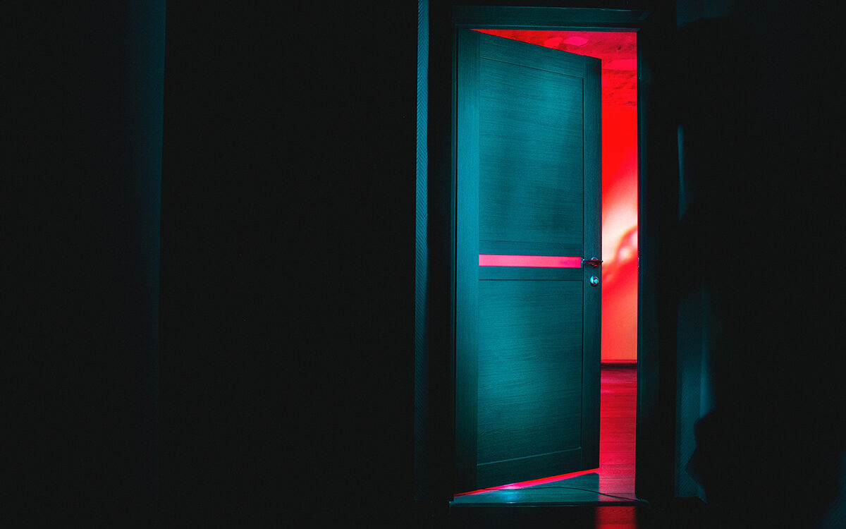 Feature photo by Dima Pechurin/Unsplash Door opening from a black room into a brightly colored room
