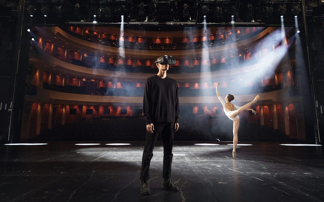 XR Stage – Next Stage Grants Recipient 2022 © Finnish National Opera & Ballet Image of a man using a VR headset on a stage with a ballerina in the background.