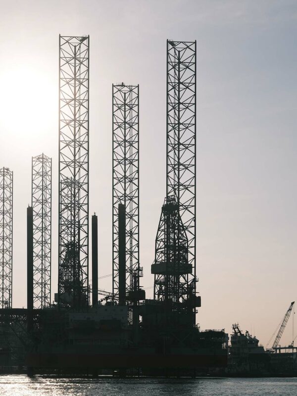 Towers and cranes out on the water