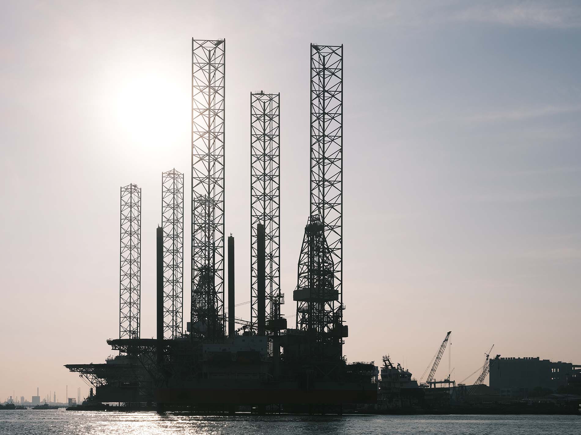 Towers and cranes out on the water