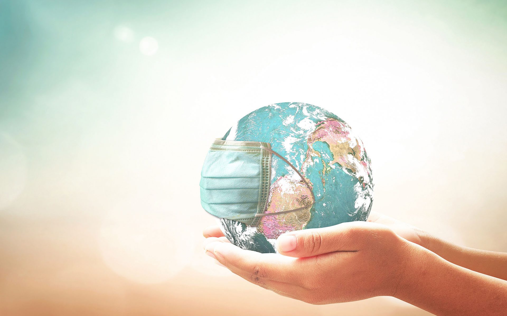 Photo-Credit-Choat-AdobeStock Person holding the world in their hands.