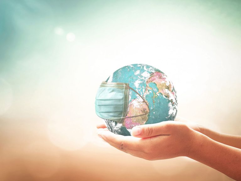 Person holding the world in their hands.