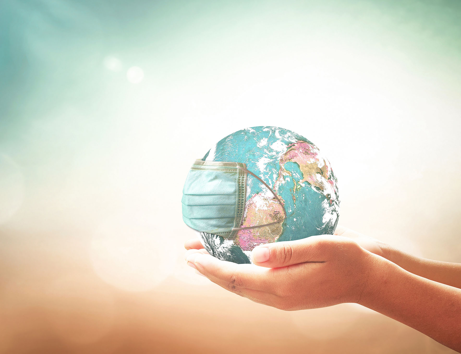 Person holding the world in their hands.