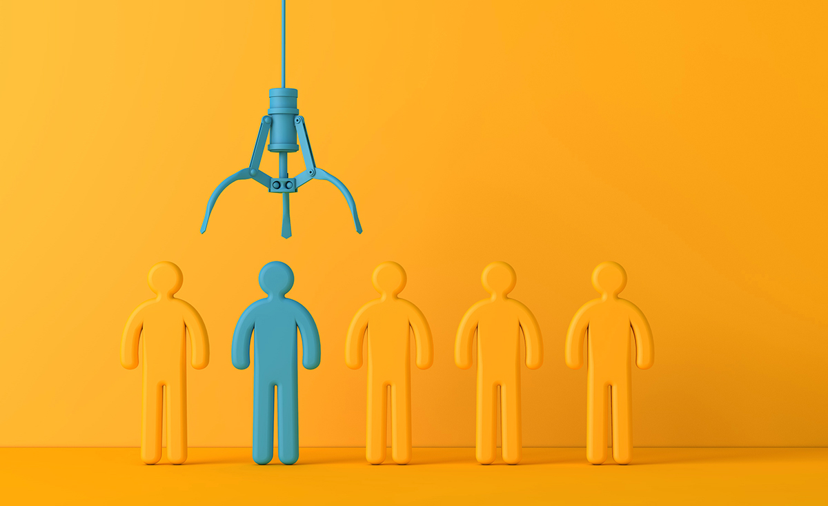 Employee recruitment concept with claw picking a new team member.