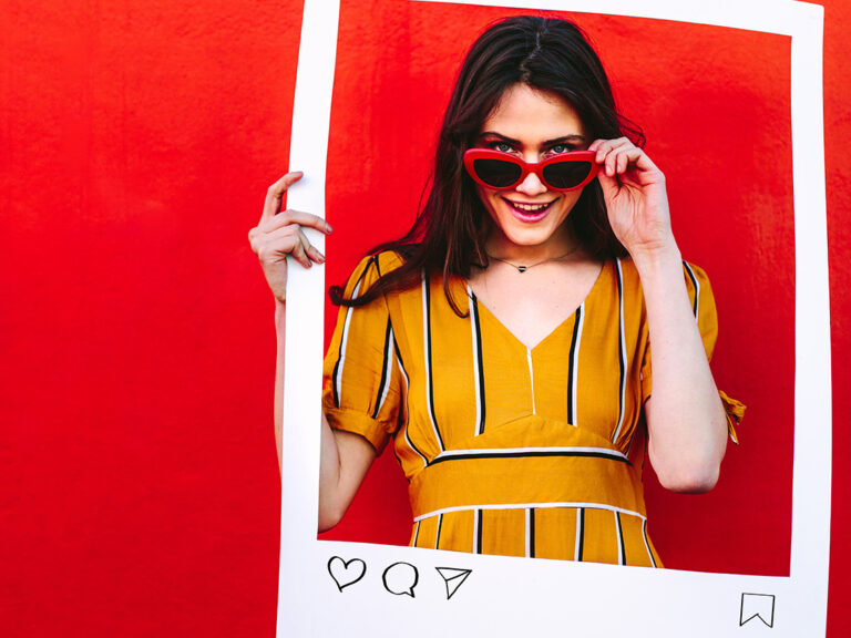 Woman posing with social network post photo frame