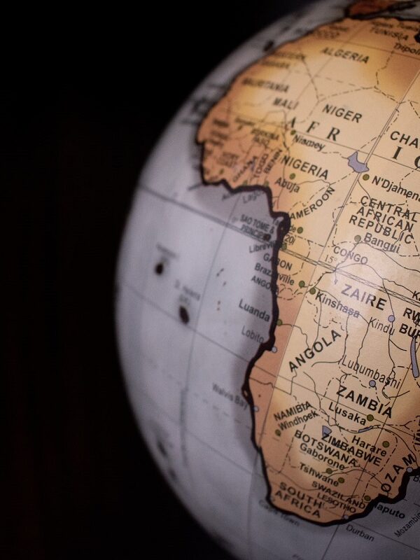 James Wiseman/Unsplash Picture of the globe with a focus on the continent of Africa