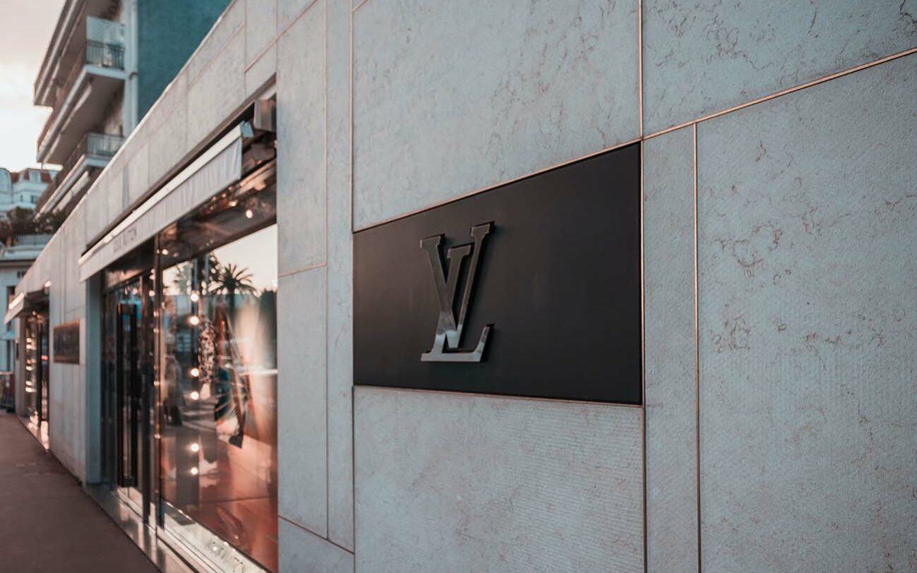 Feature photo by Jannis Lucas/Unsplash Feature photo by Jannis Lucas/Unsplash. Photo of Louis Vuitton logo outside a store.