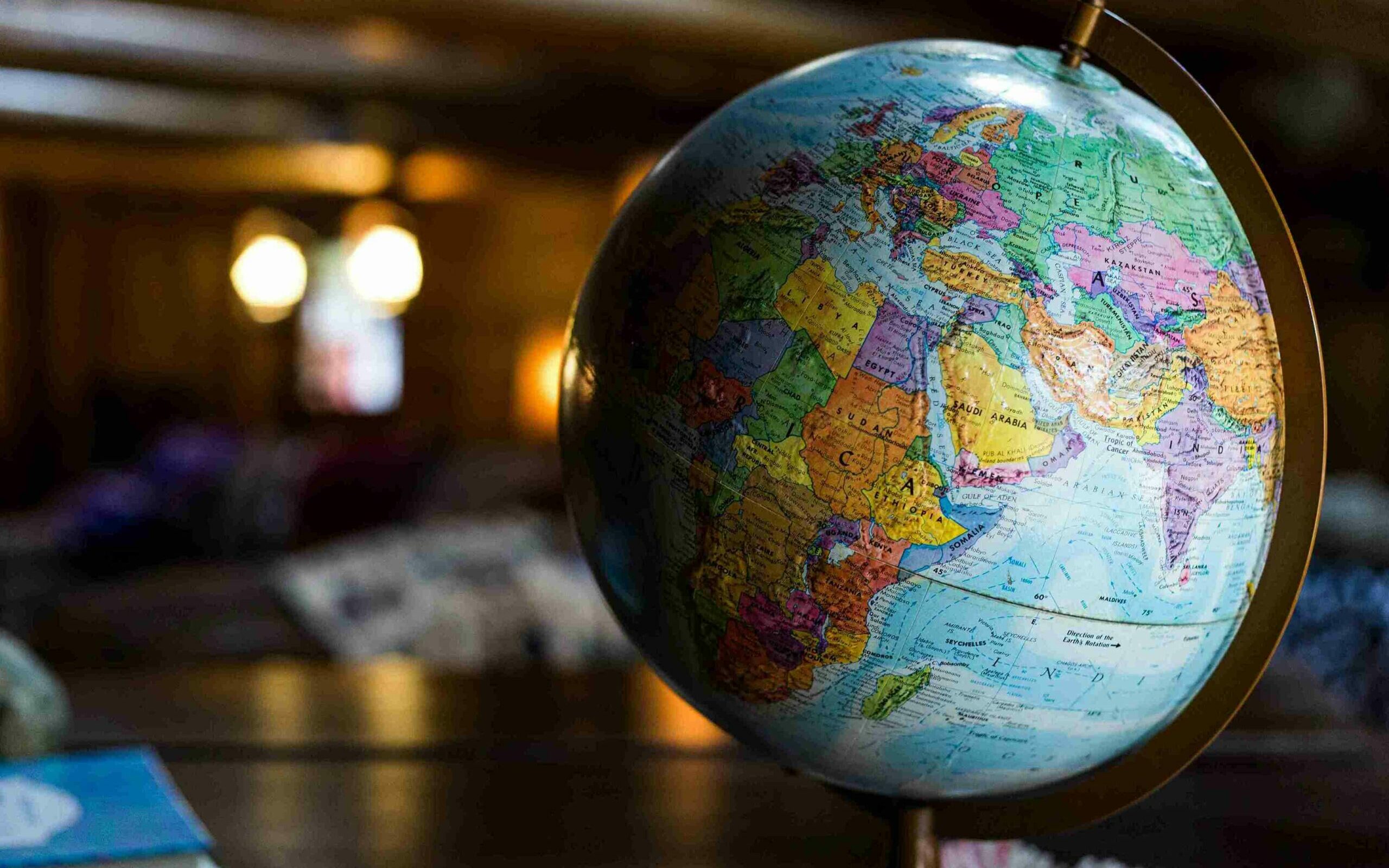 ©Kyle Glenn / Unsplash A close-up photo of a globe sitting on a table.
