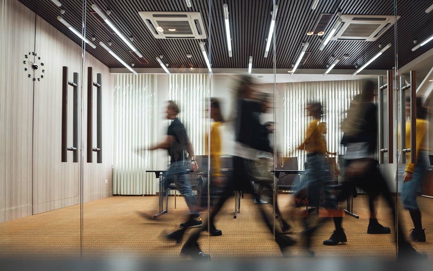 Leonidkos/AdobeStock Group of office employees at coworking center.