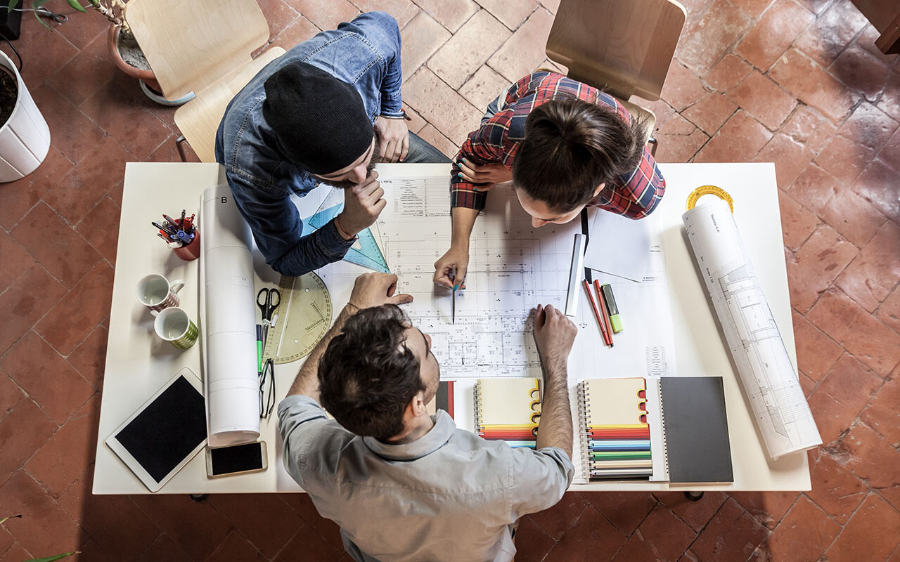 ©loreanto / Adobe Stock Teamwork. Three young architects working on a projec, ©loreanto / Adobe Stock