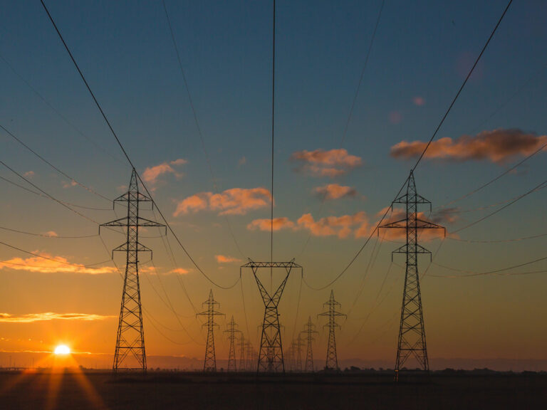 Power pylons at sunset