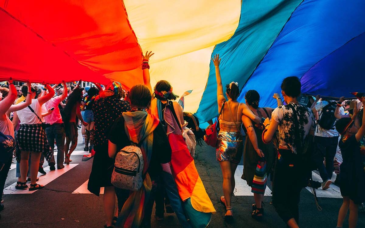 Mercedes Mehling/Unsplash People celebrating at a Pride parade.