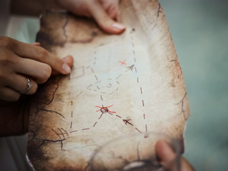 Photo of people looking at a homemade treasure map
