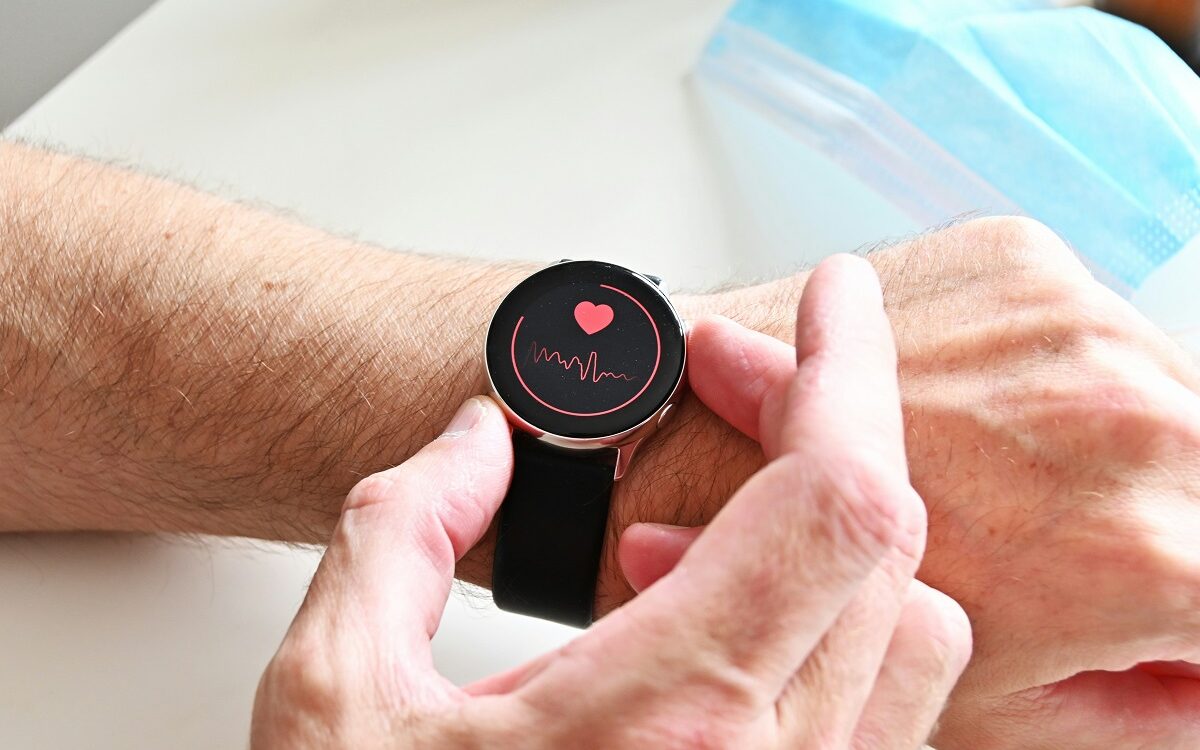 ©Nik / Unsplash Photo of a smartwatch displaying heart rate tracking being worn on a wrist