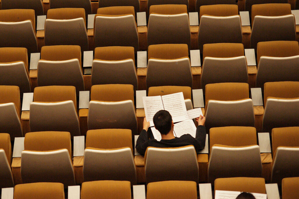 Musician checking music sheet before Concert, ©Philippe Bout / Unsplash