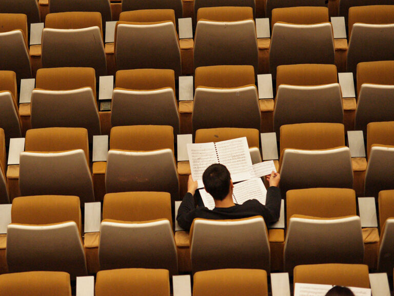 Musician checking music sheet before Concert, ©Philippe Bout / Unsplash