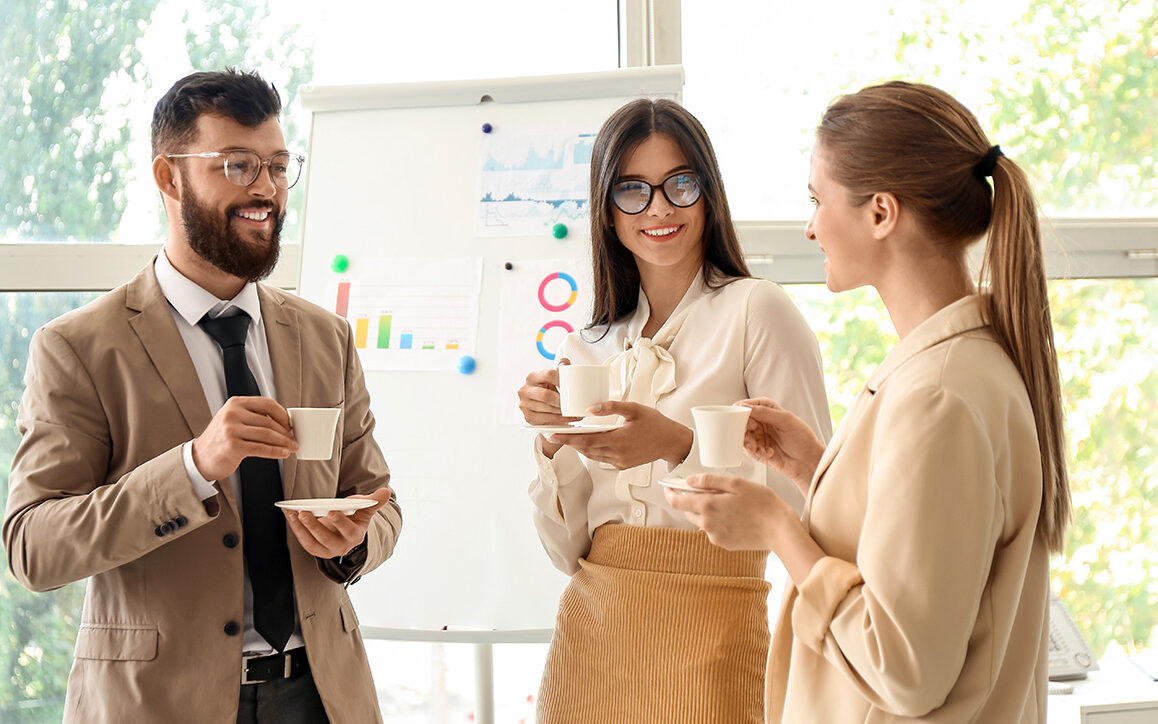Business people having coffee break in office