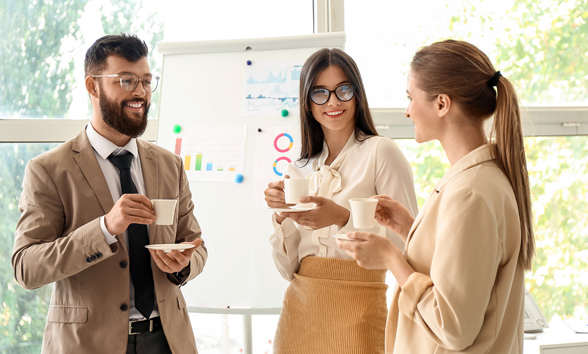 Business people having coffee break in office