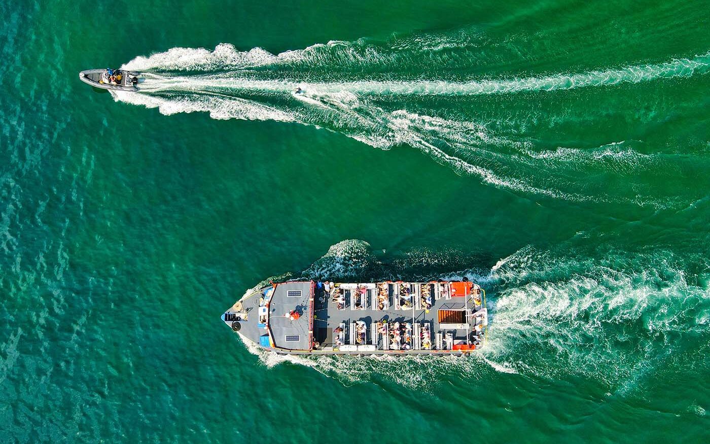 ©Red Zeppelin/Unsplash ©Red Zeppelin/Unsplash. Speedboat and passenger boat in the UK waters.
