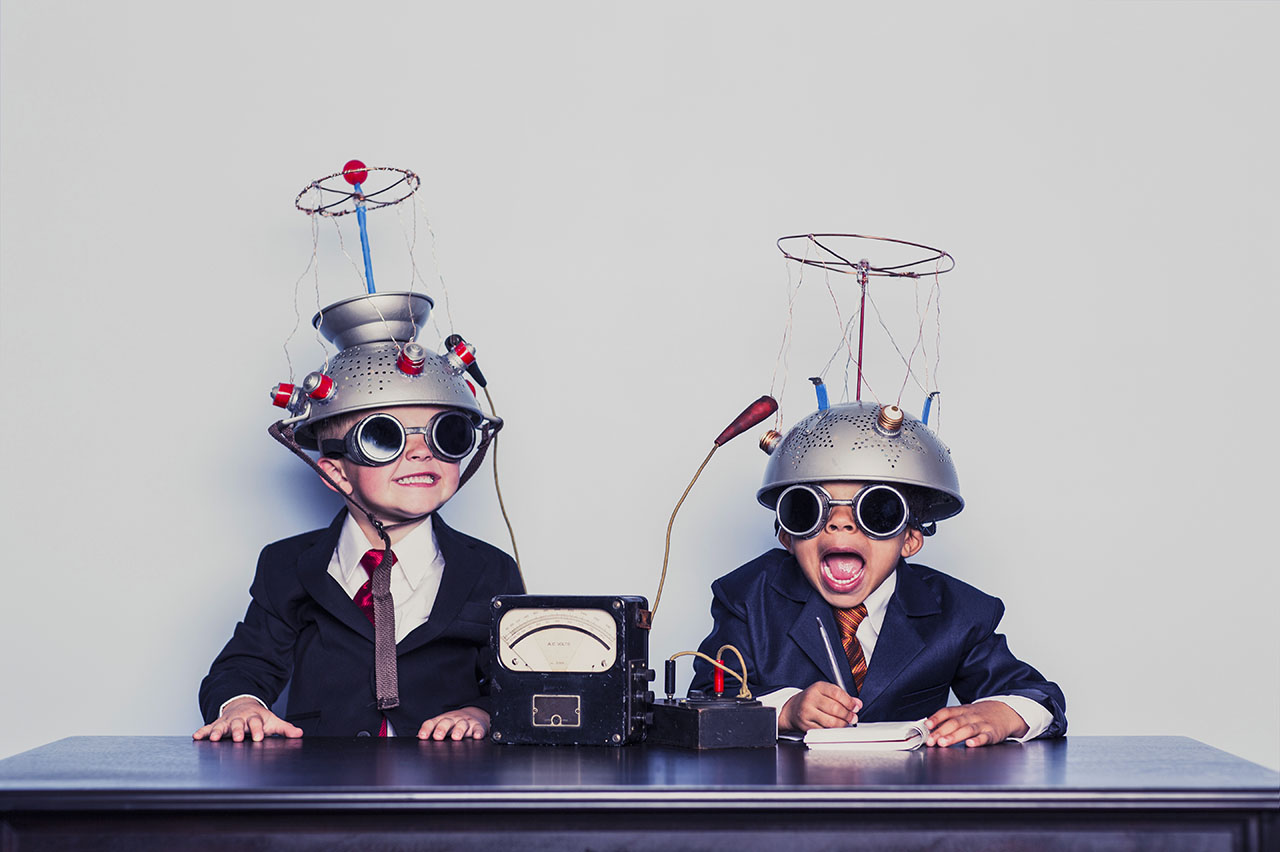 Boys Dressed as Businessmen Wearing Mind Reading Helmets,