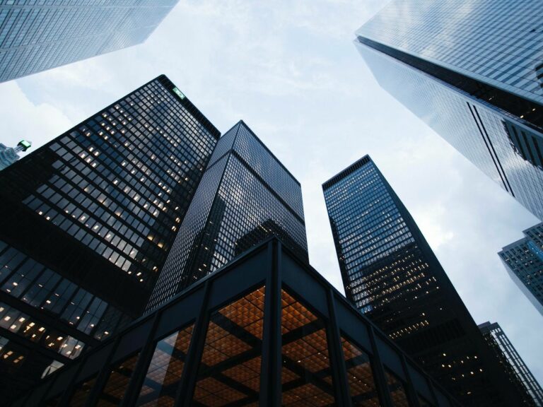 ©Sean Pollock/Unsplash. Image of someone looking up at a building.